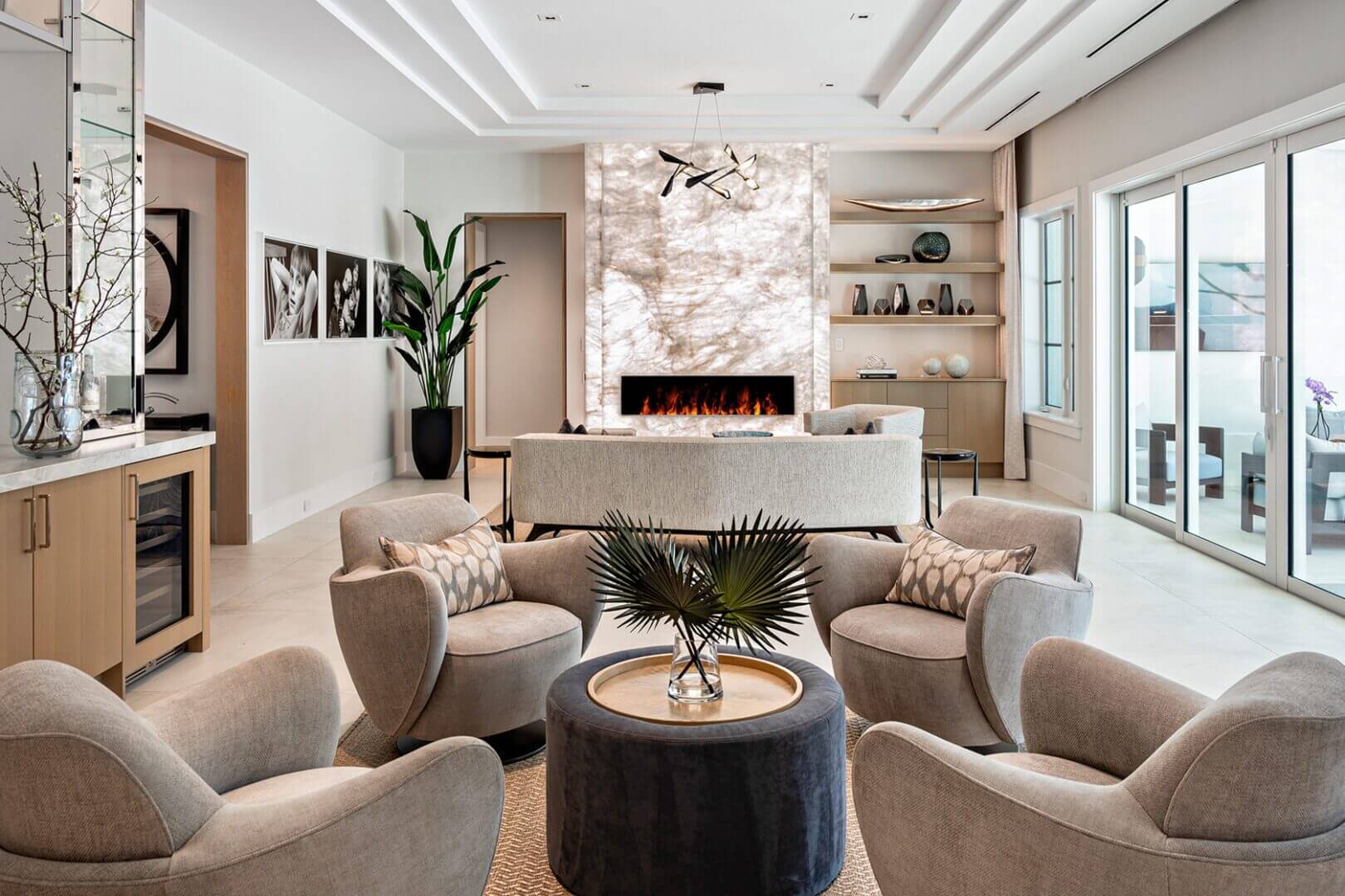 Modern living room with fireplace and seating.
